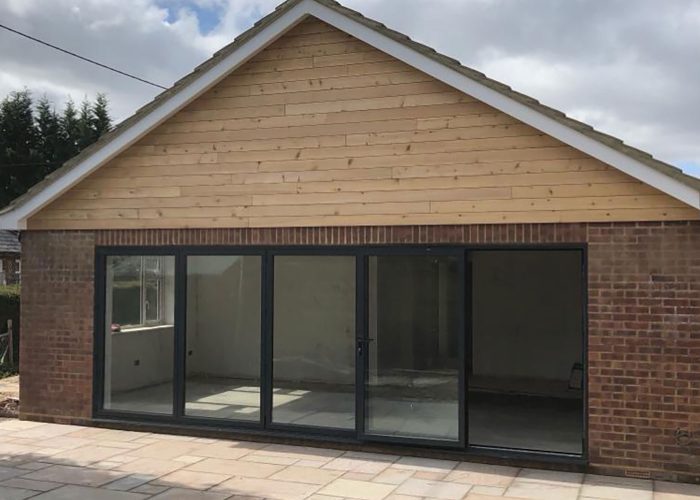 timber cladding and bifold doors